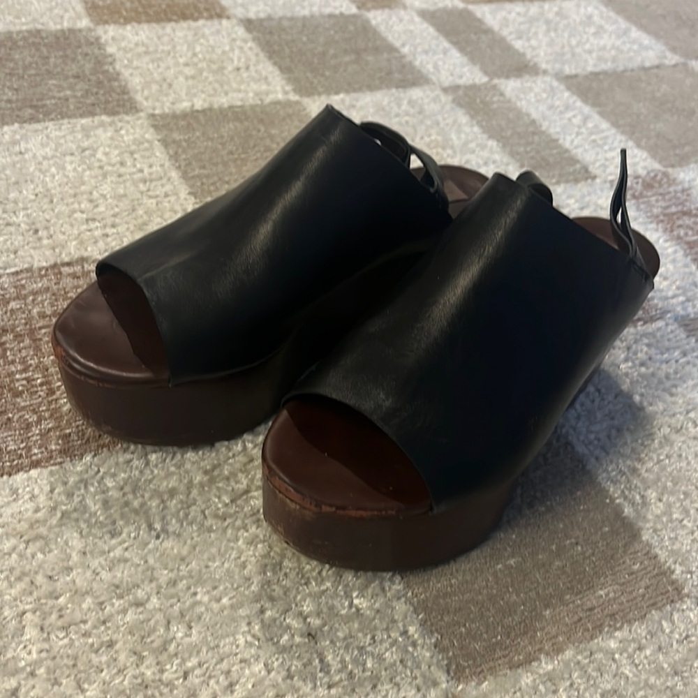 Well worn See by Chloe platform sandals.
